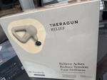 New Therabody Theragun Relief Handheld Massage Tan Cream Sand. Fixed Price $129.00.