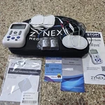 Zynex Medical Nexwave Tens Unit With Leads, Batteries, Padded Case & Electrodes. Fixed Price $130.00.