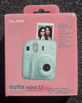 Brand New Fujifilm Instax Mini 12 Instant Camera Mint Green. Fixed Price $74.74.