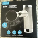 Nuvomed Mini Massager Full Body Rechargeable Vibrating Abs Silver Black. Fixed Price $10.00.