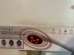 Mahli Handheld Heat & Vibration Massager. Fixed Price $35.00.