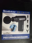 Brookstone Cordless Percussion Massager 4 + Interchangeable Heads Rechargeable. Fixed Price $37.99.