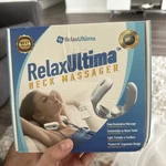 Relaxultima Electric Tens Pulse Technology Portable Neck Massager In White. Fixed Price $35.00.