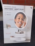 New Sharper Image Spa Studio Vanity Plus 10" Mirror With Storage V57225 3-SIS. Fixed Price $250.00.