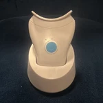 Rechargeable Electric Facial Massager W/ Charging Stand, Plastic, White/blue. Fixed Price $15.50.