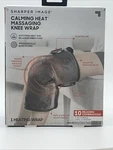 Sharper Image Calming Heat Massaging Knee Wrap New. Fixed Price $35.99.