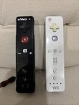 Nintendo Wii Remote RVL-003 White & Nyko Wand Wireless Controller Black. Fixed Price $14.00.