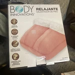 Body Innovations Soothing Foot Warmer Massager, Pink. Fixed Price $22.00.