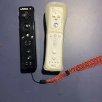 Nintendo Wii Remote RVL-003 White & Nyko Wand Wireless Controller Black. Fixed Price $29.78.